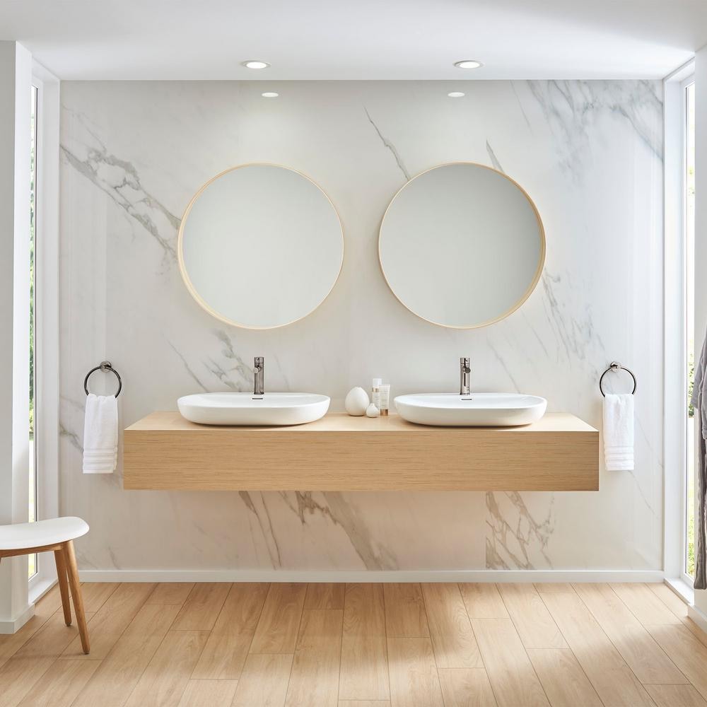 Robinet de lavabo de salle de bain à arc bas et à poignée unique Essence à trou unique en chrome Starlight (robinet et drain inclus)