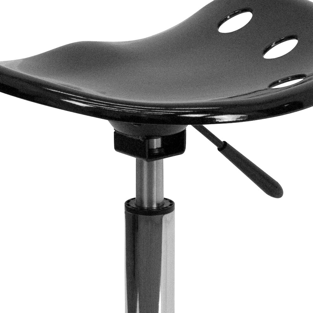 Siège de tracteur noir vibrant et tabouret chromé