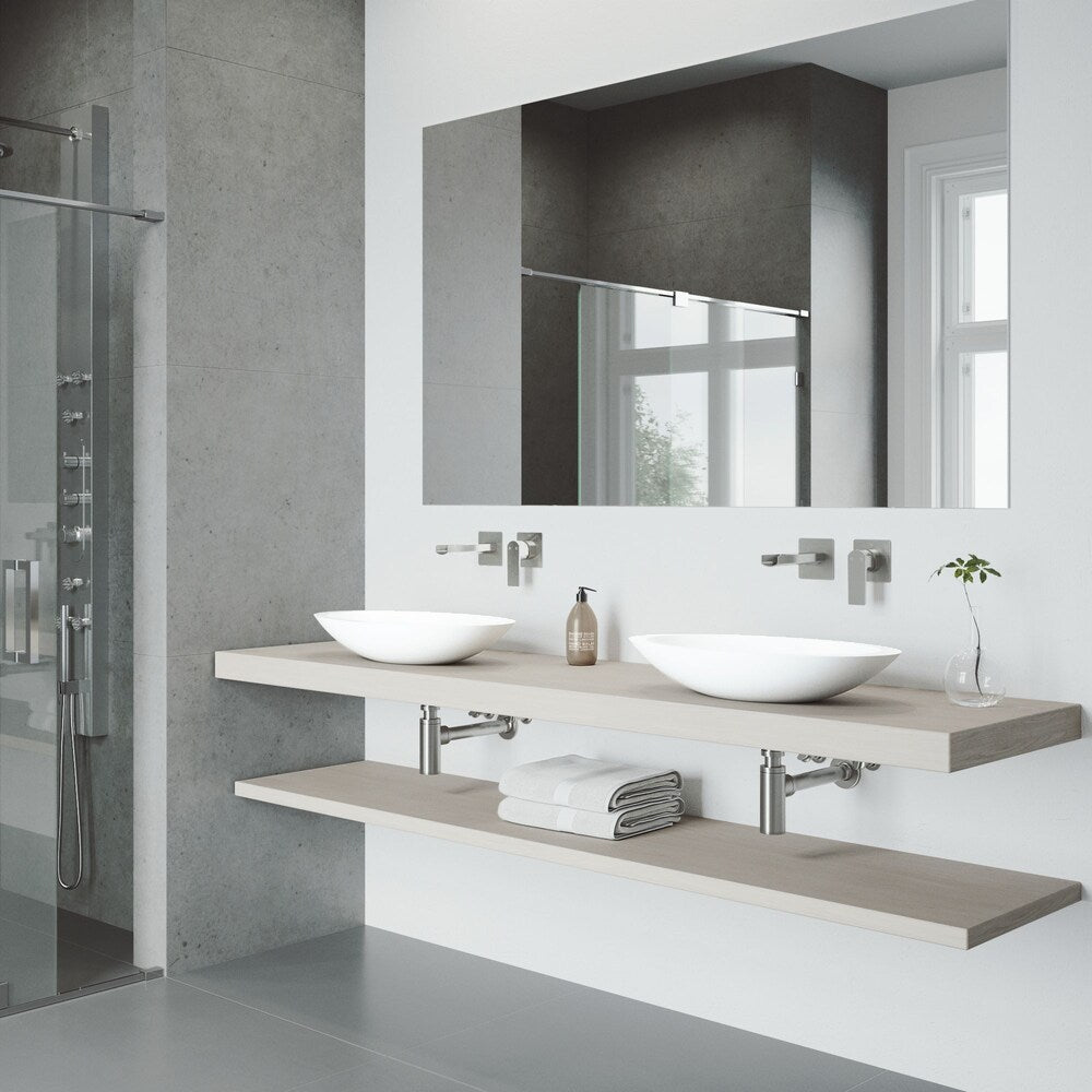 Robinet de salle de bain mural à poignée unique Atticus en nickel brossé