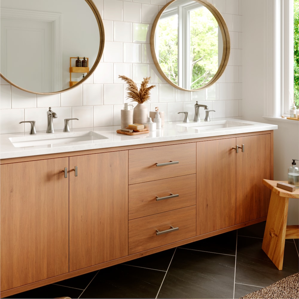 Woodburn Widespread Three-Hole 2-lever Bathroom Faucet with Matching Pop-Up Drain in Stainless Steel