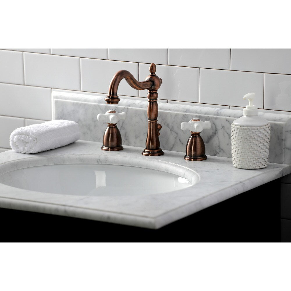Heritage Porcelain Cross 8 inch Widespread 2-Handle Bathroom Faucet in Antique Copper