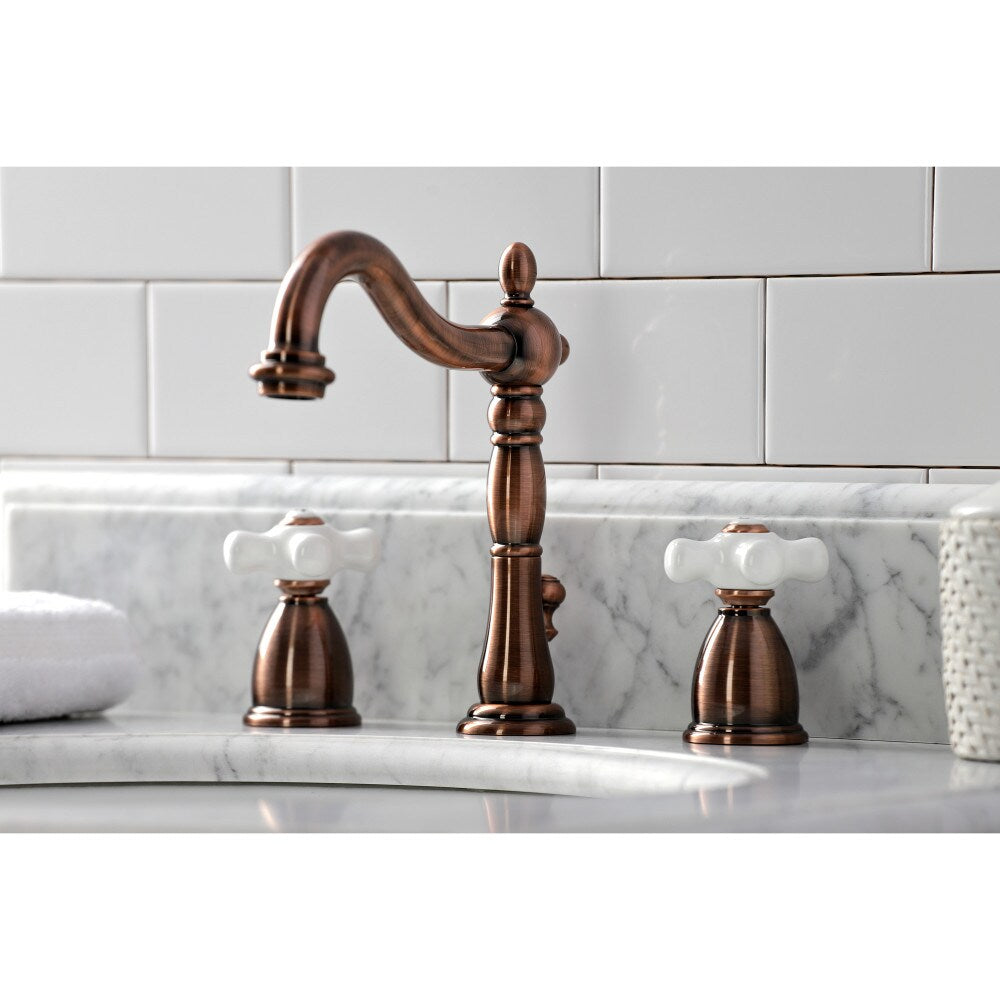 Heritage Porcelain Cross 8 inch Widespread 2-Handle Bathroom Faucet in Antique Copper