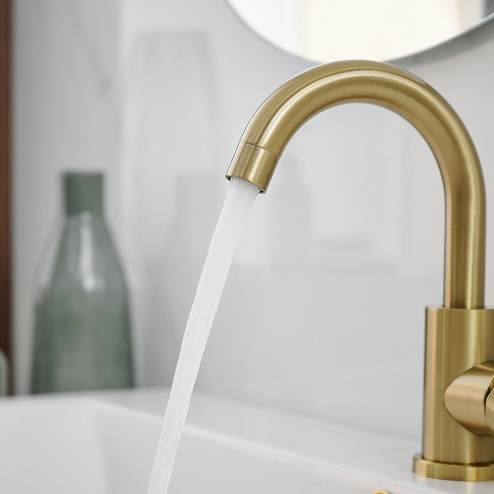 Robinet de salle de bain monotrou à poignée unique et bec pivotant en or brossé