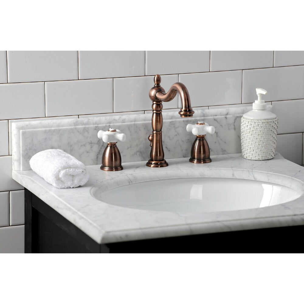Heritage Porcelain Cross 8 inch Widespread 2-Handle Bathroom Faucet in Antique Copper